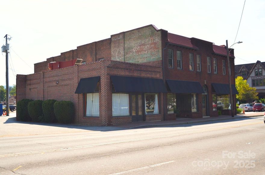 Formerly known as the Biltmore Hardware Building, this property is on the U.S. National Register of Historic Places and has been the heart of Historic Biltmore Village for 100 years. This mixed-use space sits at the corner of Hendersonville Road and Lodge Street and boasts a combined 270 FT of road frontage. Located a highly trafficked signalized intersection, Biltmore Hardware has historically recorded 34,999 VPD. The main floor has restaurant and retail space. The upper level has executive office suites. Currently under renovation. This is an incredible investment opportunity for a owner/user and own a piece of Asheville's history.