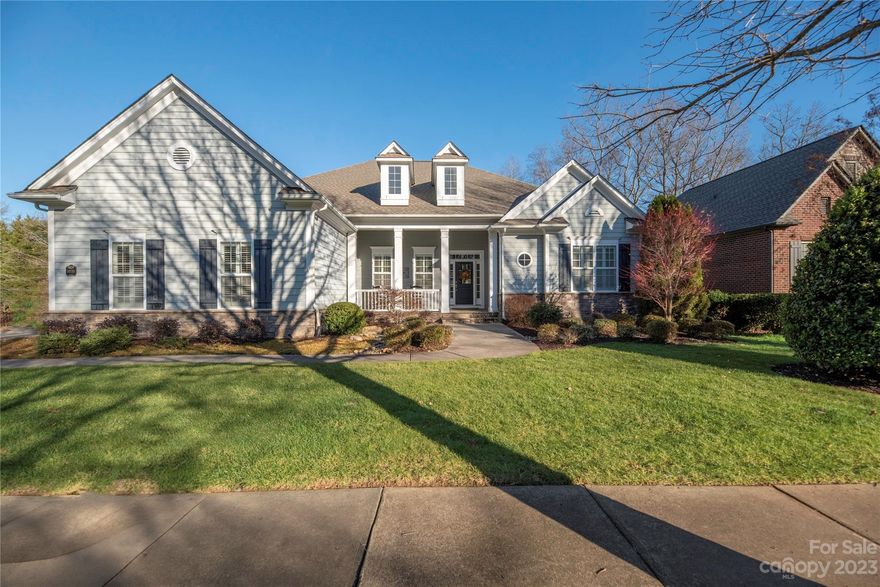 This immaculate well-kept, David Weekley ranch boasts a backyard oasis that is a must see! Rare location on a corner lot, flanked by a dead-end side street that provides additional parking. The home has a split bedroom floor plan, a study and an additional flex space with built-in desk for multiple office/school use. Kitchen, equipped with brand a new cooktop (installed December 2023), opens up to the great room with built-ins and gas log fireplace. Spanning across the back of the home is a spacious, light-filled sunroom with a 2nd gas log fireplace - an entertainer's delight! The sunroom includes a built-in gas grill, refrigerator, sink, cooking/prep area and a stunning view of the exquisite backyard. Walk out to the private, tree lined backyard with multi-level patio seating, gas fire pit, ponds, waterfalls and intertwining paths complete w/landscape lighting and irrigation. The community features 2 salt water pools, playground, walking trails and a neighborhood restaurant.