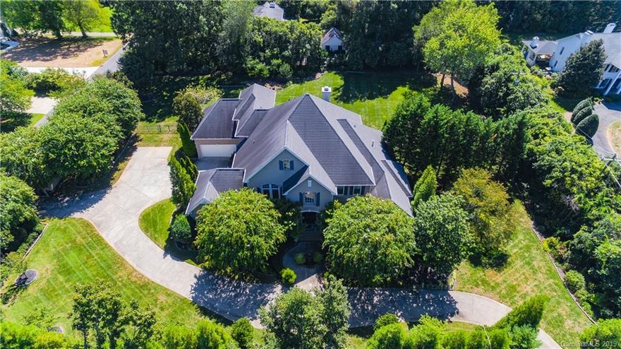 Exquisite Custom Home on estate sized 1.28 acre lot located in the much desired Foxcroft neighborhood! Two entry gates and beautiful lush landscaping create an amazing setting for complete privacy. This is the perfect home for entertaining family and friends with an exceptional floor plan. A grand 2 story foyer greets you with a beautiful curved staircase and a barrel vaulted ceiling. There is plenty of space for everyone - formal spaces, great room, study next to master bedroom as well as a guest suite on the other end of the main level for privacy. The huge master bathroom includes his and hers water closets. Gourmet kitchen with island, glass front cabinets, wine storage, Sub-Zero refrigerator, double ovens and warming drawer. Three large bedrooms upstairs, exercise room, rec room and media room. There are many special custom details throughout this home featuring beautiful trim work/moldings, 10ft+high ceilings, 2nd staircase plus many windows for natural light. Truly incredible!