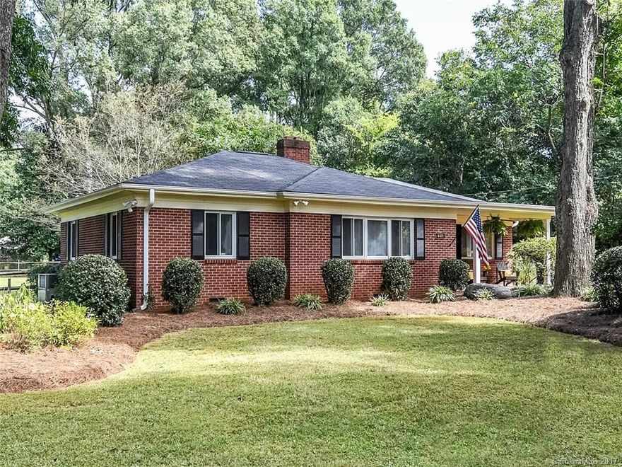 GREAT opportunity in SUPER HOT COTSWOLD. Charming brick ranch located in private Cotswold setting. Large 1/2 acre level fenced lot suitable for home expansion & pool. Cozy living room w/ hardwoods & fireplace. The third BR was converted to a den which opens to private deck and kitchen. This popular area is taking off- with homes in the area selling for over $750K. Schools are top rated- Myers Park HS, AG & Cotswold Elem. Convenient to Cotswold Mall, SouthPark shopping & Downtown. Seller Finance.