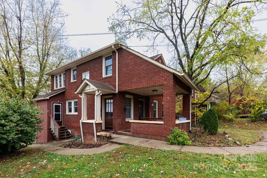 1925 Brick Home. Great central location just off Merrimon Ave. Walk to restaurants, shopping, etc. Convenient to UNCA, and all that Asheville has to offer. Currently rented as Multi-Family with one 1BR/1BA apartment and one 2BR/1BA apartment. Zoning is RS8. Per Seller, was grandfathered as a triplex. Shared laundry and storage area in the unfinished basement which was previously a 3rd apartment. Detached 2 car garage (shared) but with potential as ADU, Buyers Agent to confirm. Covered front porch. It is possible that it could be easily converted back to a Single Family Residence. See also MLS #4345023.