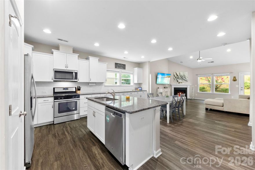 Motivated seller — bring your offers! This light-filled home features a highly desirable main-level primary suite with a walk-in closet and an updated en-suite bath. Vaulted ceilings and an open-concept layout create an airy feel, flowing into a spacious kitchen with ample cabinetry, countertop space, and modern finishes. A versatile flex room offers endless options for a home office, dining room, or bonus space . Upstairs includes three generously sized bedrooms, all with walk-in closets, a spacious loft, a large full bath, and brand-new carpet throughout. Exceptional storage throughout the home. Enjoy a private, low-maintenance backyard ideal for relaxing or entertaining. Ideally located across from East Mooresville Intermediate School and just 3 minutes from Carrigan Farms. Move-in ready, well-located, and priced to sell - don’t miss this one.