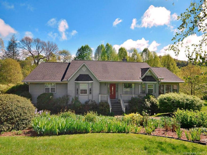 You'll never want to leave this peaceful, inviting home located on a cul-de-sac in desirable FLAT ROCK. Enjoy year mountain views from the expansive deck overlooking an established organic perennial garden in a park like setting. Lower level offers guest suite, game room and ample storage with built in shelving. Main level includes a gorgeous sunroom, family room, dining room and all are overlooking the meticulously maintained grounds. Adjacent lot is also available for sale.