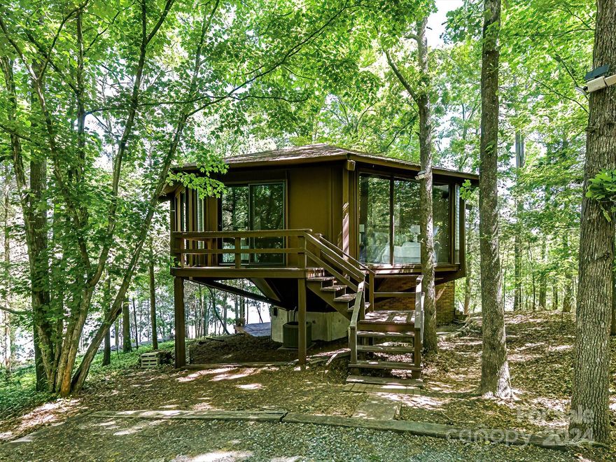 Discover this charming waterfront gem on Lake Wylie, a haven that has been owned and lovingly maintained by one owner since its construction in 1970. Boasting breathtaking views, this home is an idyllic retreat for both active summer days on the water and tranquil winter evenings surrounded by serene woods and the peaceful lake. The property features a private dock perfect for boating enthusiasts, and expansive decking that offers limitless potential for outdoor living. Adorable and full of charm with precious updates and new appliances, this residence encapsulates the essence of a perfect lake home. Imagine yourself here, where every day feels like a vacation. Welcome to your lakeside dream!