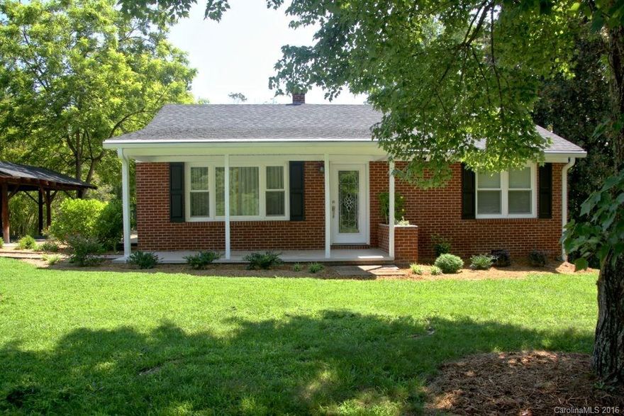 This 2 bedroom brick house is great smaller home.  It is walking distance to top rated SC schools, town park, library, a classic vibrant small town downtown, and 2 miles from I-26 puts Spartanburg and Hendersonville within easy reach.  This home has been upgraded with new floors throughout, thermo pane tilt in windows, new kitchen cabinets and appliances and updated electric, plumbing and smoke detectors.  The 1/2 acre lot has a grass front and large backyards that includes a vineyard and shed.