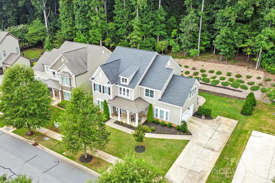Experience refined living in this elegantly reimagined home, where every space blends sophistication with comfort. The main level boasts warm engineered hardwoods, a private guest suite with a designer bath, and a great room wrapped in surround sound beside a glowing gas fireplace. The gourmet kitchen is a culinary statement—farmhouse island sink, professional-grade gas cooktop, dual ovens, stainless steel hood, built-in microwave, and a custom walk-in pantry. Upstairs, your primary sanctuary offers dual vanities, his-and-hers closets, a frameless glass shower, and a soaking tub for ultimate relaxation. The loft invites creativity or leisure. Step outside to your all-season retreat: a polished concrete patio enclosed by glass sliders, ceiling fan, TV wiring, and an outdoor island with fridge and gas hookup. Enhanced by an expanded lot, side-entry garage, fresh exterior paint, and premium HVAC filtration—this home elevates everyday living into an art form.

Use preferred lender to buy this home and receive an incentive towards your closing costs!