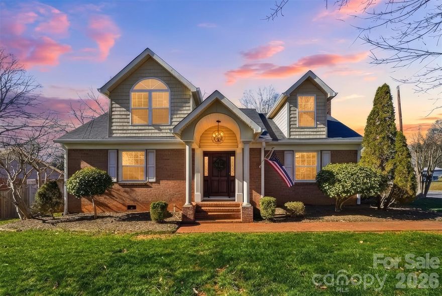 Situated in the heart of Newton, this beautifully reimagined brick home blends timeless craftsmanship with elevated modern design. Originally built in 1959 and extensively renovated in 2024, with a newer roof installed in 2023, this residence offers 1,979 square feet of refined living space thoughtfully curated for today’s lifestyle. The interior showcases a fully redesigned kitchen complete with stainless steel appliances, refinished hardwood floors, new carpet, and fresh paint throughout, creating a cohesive and sophisticated aesthetic. The former open breezeway has been transformed into an elegant formal dining area, enhancing both flow and function for everyday living and entertaining. At the heart of the home, the living space is anchored by a stunning floor-to-ceiling stone gas log fireplace, creating a dramatic focal point that adds warmth, texture, and architectural interest. Bathroom updates continue the elevated feel of the home. The downstairs full bath has been completely gutted and redesigned, while the upstairs full bath has been tastefully updated with new countertops and a tub/shower combination. The half bath has also been refreshed with modern finishes, ensuring continuity throughout. Outside, the classic brick exterior delivers lasting curb appeal, while the fenced backyard and concrete patio provide a private setting for outdoor enjoyment. A two-car garage adds convenience, and the home is being offered with stainless steel appliances, washer, and dryer included, making it truly move-in ready. With its thoughtful renovation, high-end finishes, and prime location near downtown Newton’s shopping, dining, and amenities, this home presents an exceptional opportunity for buyers seeking quality, character, and turnkey living.