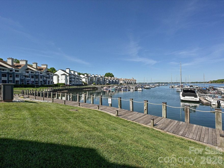 Live the lake life at Vineyard Point! This ground floor condo features an oversized screen porch, complete with a daybed swing, just steps from the Bayview pool! All one story living in this updated home makes your life easy and elegant. Relax by the gas fireplace, stroll down the community marina's boardwalk or take your boat out for a spin - the choice is yours! Just minutes away from Morningstar Marina, you can refuel your boat nearby for a day's excursion with friends or walk to Birkdale Village for shopping or restaurants! If you prefer to stay home, you have a full kitchen with quartz countertops and a dining area. Walk to the community marina on July 4th and watch the spectacular fireworks display on the lake, never having to move your car once! Be sure to check out the sunsets here...they are spectacular on Lake Norman! Yes, you can have it all at an affordable price with this great condo!