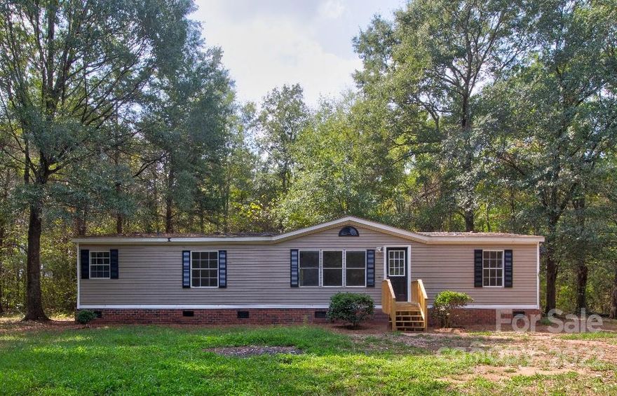 You can have it all with this newly renovated 3/2 manufactured home that sits on a private 1 acre of land. Many upgrades throughout: new granite countertops, large cabinets, new appliances, recessed lightning, new flooring and so much more! The perfect blend of country living with the all the convenience of a modern home. Minutes away from Winthrop University and downtown Rock Hill