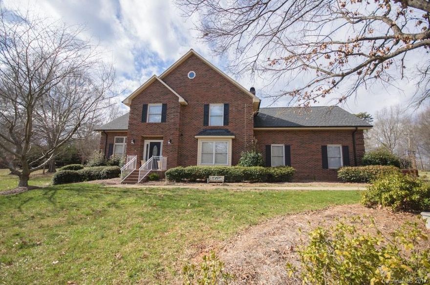 Gorgeous custom brick home in country club area of Lincolnton on over an acre.  Home features 4 bedrooms and 2.5 baths, an office on the main floor, hardwoods & tile throughout (no carpet), pocket doors, french doors, recessed lighting, 2 fireplaces (1 in master bedroom), beautifully updated kitchen with stainless appliances & granite counters, composite decking, large detached one car garage/workshop, as well as, a two car attached garage.. too much to list!!