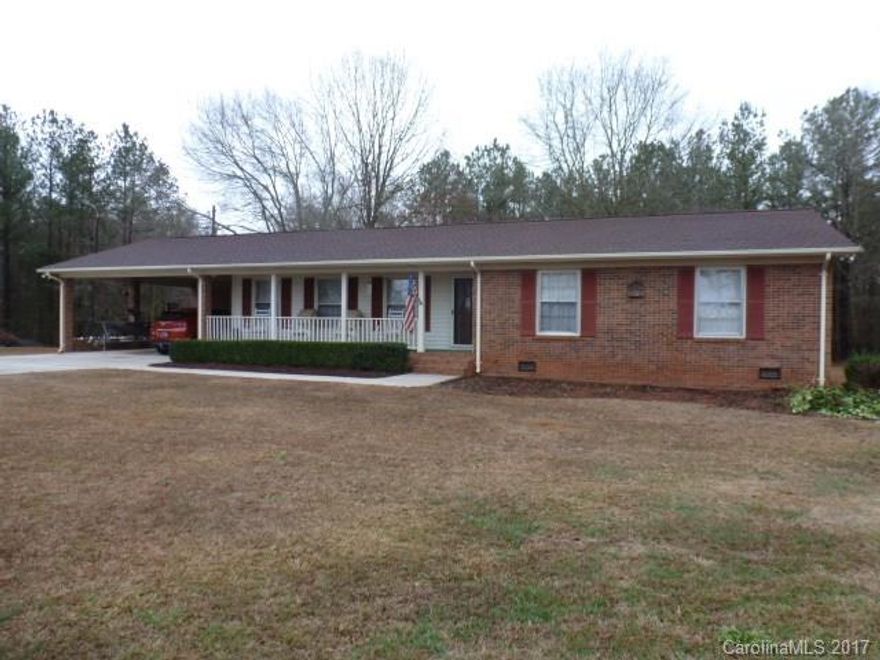 Need peace and quiet, try country living, in this all brick ranch home on 6.24 acres. Home features oversized greatroom with fireplace/gas logs, great kitchen with all stainless appliances, 3BR, 2BA, lg laundry room. Dbl attached carport, outbuilding, and 2 stall barn. Well on property. Lots of room to play, garden, have horses bring them.