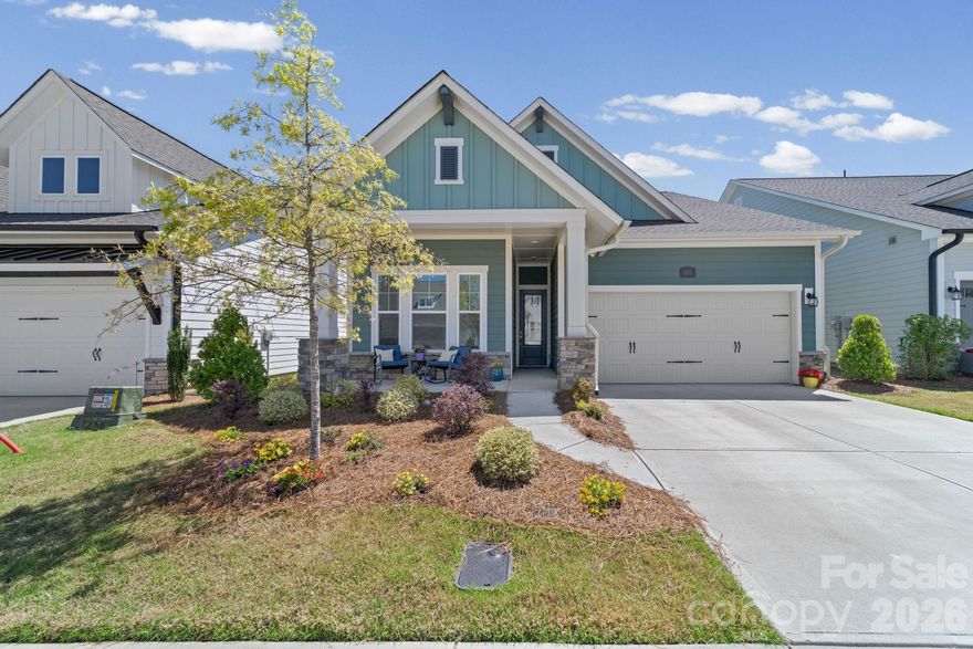 Beautiful 3BR + office home in Encore at Streamside, a highly sought-after 55+ community in Waxhaw. This David Weekley “Flourish” floor plan offers 2,256 sq ft with an open, light-filled layout and thoughtful upgrades throughout. The gourmet kitchen features a large quartz island, gas cooktop, wall oven, and walk-in pantry, opening to the spacious Great Room with an electric fireplace. Main-level primary suite includes a roll-in shower and custom closet system. An additional bedroom and office are also on the main level, with a loft, bedroom, and full bath upstairs—ideal for guests or flex space. Enjoy outdoor living on the screened rear porch overlooking a level yard, plus a welcoming covered front porch. Encore at Streamside offers resort-style amenities including clubhouse, fitness center, pool, pickleball courts, dog park, and walking trails, along with a full calendar of community activities. Convenient to Waxhaw, Marvin, and area shopping and dining.