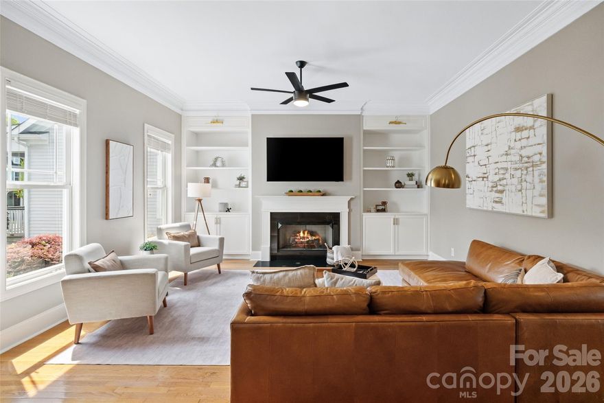 This Charleston-style residence offers 3,185 square feet of beautifully finished living space, with timeless Southern architecture and refined, modern design. Located in the highly sought after Ardrey neighborhood.

From the moment you arrive, the home’s classic curb appeal is undeniable—welcomed by a charming covered front porch perfect for rocking chairs and relaxed evenings. Inside, the main level showcases rich hardwood floors, a light-filled and functional layout, and thoughtfully designed living spaces enhanced by custom built-ins and updated finishes throughout.

The kitchen features fresh white cabinetry and a clean, modern aesthetic, seamlessly connecting to the main living areas for effortless everyday living and entertaining. The primary suite is conveniently located on the main level and serves as a private retreat, complete with hardwood flooring added in recent years. Bathrooms and the laundry room have been tastefully updated, while modern lighting throughout the home creates a cohesive, elevated feel that beautifully complements the Charleston-inspired exterior.

Upstairs, you’ll find brand new carpet, and generously sized secondary bedrooms, each offering large walk-in closets. Additional walk-in storage throughout the home provides exceptional functionality.

A true standout feature is the detached finished living quarters—complete with its own private full bath—offering a rare and highly versatile space ideal for multigenerational living, a private guest retreat, executive home office, or boutique-style home based business. This is a unique opportunity rarely found in the market.

Outdoor living continues with a screened-in porch, perfect for year-round enjoyment. Finish off the screened porch and add 775 square feet of continuous finished square footage-- making the total around 3,585 square feet with a small investment. There's also a rear-entry two-car garage accessed via a private alley, enhancing both convenience and curb appeal. Crawl space is encapsulated for peace of mind.

A seamless blend of charm, modern updates, and flexible living spaces, this home presents a distinctive lifestyle opportunity in one of Charlotte’s most sought-after settings. Top-rated schools, close to the new Ballantyne Bowl and easy access to I-485. Yard maintained by the HOA, playground and greenery space/parks thoughout, clubhouse and pool.