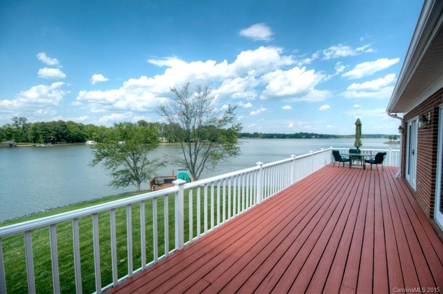 The waterfront view you've been looking for on Lake Wylie!  Panoramic views from this home on a point lot.  361' shoreline, stabilized with rip rap, nice dock with sundeck & PWC platform. Brick home, all one level, efficient floorplan, wood floors throughout. You'll love the screened porch and expansive deck, a perfect vantage point to watch the action on the lake. Master bedroom has huge view, plus bath with whirlpool and walk-in shower.  Located in excellent Clover school district.  See tour!