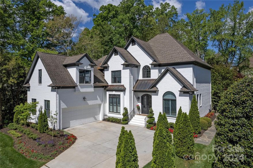 Welcome to the home where almost everything has been done, boasting over $400,000 in exquisite updates inside/out! Upon entry appreciate the walls that have been removed to create an effortless flow and allow natural light to beam throughout main level. Designer kitchen features elegant natural stone countertops, sleek new cabinets, and top-of-the-line GE Profile appliances, pull-out shelves & drawers. The Primary bed has new hardwoods with access to your screened porch. Start your day like royalty with heated tile marble floors, a walk-in glass- shower, and ample storage!  Upstairs features a bedroom with its own bath perfect for guests to retreat in peace.  All walk-in closets!  A professionally designed exterior where no expense was spared-Slate stone paths,replaced irrigation added meter, specialized garden spray system. NEW> Gutters & shields, TRANE HVAC/Cleanair system,water filtration, hot water heater, generator, sealed crawl space. Excellent location to the best of Charlotte.