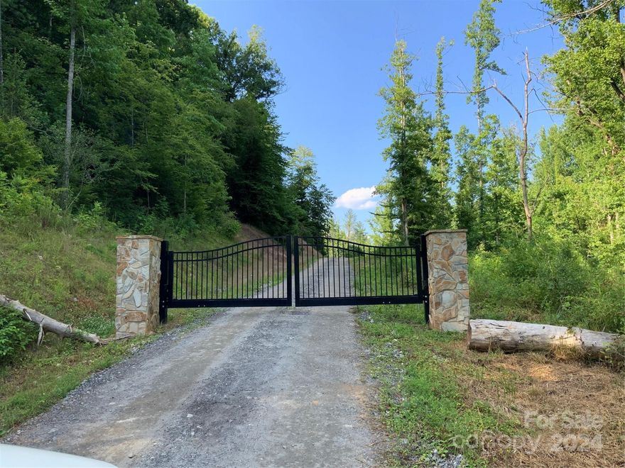 From the moment you enter this gated property, you will know this is a one of a kind.  This property has two gated entrances in place with solar powered openers.  As you enter the southern gate the Johns River forms the property border with approx. 10,000 ft of river frontage.  Multiple areas of the property have been cleared down to the river for easy access.  A well maintained, graveled road allows for easy property navigation.  Discover the many paths that have been cleared on the property that allow for high and low river views.  As you enter the western gate of the property you will travel along wide, cleared roads and discover long range mountain views that are stunning. At each turn the mountain views get bigger and better and ultimately lead to the most special view of Table Rock Mountain. Signs of whitetail, turkey and bear can be found all over.  Purchase as an investment for both the timber and development potential or create the ultimate family farm or hunt club.