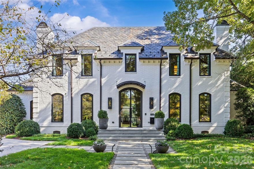 A rare mix of modern comfort and classic Eastover character, this home balances scale and warmth with an easy, versatile floor plan. Eleven-foot ceilings, beautiful millwork, and five sets of steel and glass doors bring natural light into every corner, opening the home to a private bluestone terrace, pool, spa, and pergola.

The main level flows effortlessly for everyday living or gracious entertaining.  Generous dining room with modern glass chandelier & fireplace, coffered-ceiling living room with bar and gas fireplace opens to the terrace, and a study with fireplace & custom backlit shelving- beautiful rooms for all your needs. The open kitchen, morning room & dining area are perfect for busy days or relaxed weekends. The renovated kitchen features quartzite counters, custom cabinetry, island with seating for 8, Thermador professional gas range, Sub Zero refrigerator and bev. fridge.  The scullery hosts an additional beverage refrigerator, and abundant cabinetry.

The main floor primary suite offers private garden views, dual closets, built in cabinetry, custom bed, and a spa-like bath. Upstairs four large ensuite bedrooms, an additional office or fifth bedroom, and a large central living room are functional and beautiful. The third floor includes a full gym with sauna and plumbing for a plunge pool. Control 4 whole home automation and museum quality lighting are just a few of the special touches.

Glass and steel doors open to the beautiful outdoor living spaces- the bluestone terrace with seating around the wood burning fireplace, spacious dining area with built in grill and refrigerator.   The pool and spa center on the cabana with a modern firepit and generous seating all surrounded by a fully fenced yard with mature landscaping. 
 
A detached three-car garage includes conditioned wine storage and stairs to a future guest or studio space. Set on a private low maintenance lot in the heart of Eastover, 727 Colville offers livable elegance in an extraordinary location.