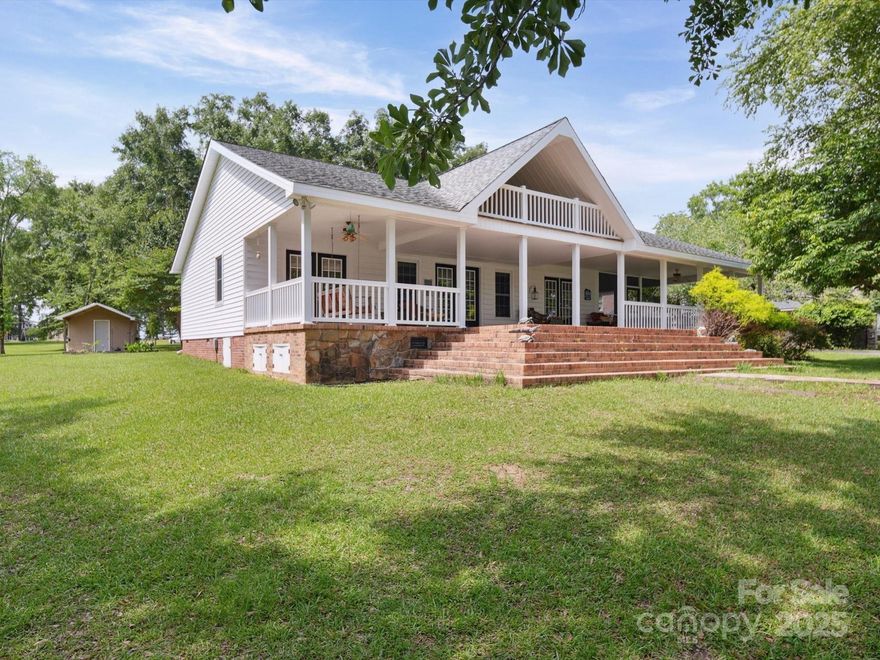 Welcome to this stunning 3-bedroom, 2-bath single-family home on 1.08 acres with 200 feet of waterfront. Boasting 2,058 SF of thoughtfully designed living space, this lakefront gem offers the perfect blend of comfort, elegance, and outdoor beauty. Step inside to discover hardwood floors, a cozy fireplace, and a gourmet kitchen featuring custom cabinets, breakfast bar/island and granite accents—perfect for entertaining or quiet evenings at home. The open-concept layout flows seamlessly, highlighting both function and style. Enjoy morning coffee and views from the wrap-around porch. Attached 2-car garage for storage and convenience. Whether you're looking for a full-time residence or a weekend retreat, this home has it!