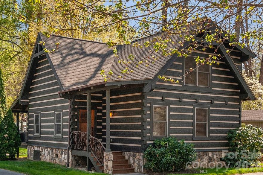 Gorgeous, unique, and rare find is this creek front log cabin w/2BD/2BA being sold completely furnished & fully equipped. This charming retreat is perfectly situated close to trout-rich Soco Creek. Relax on your covered back porch & watch family enjoying fishing & tubing in the creek. This meticulously maintained cabin features a vaulted great room w/a floor-to-ceiling stone fireplace &hardwood flooring. The kitchen boasts granite countertops, rustic-style cabinetry, & a spacious dining area. The main floor includes a king-size primary suite w/a granite-topped vanity & a ceramic-tile tub/shower. A stunning staircase w/rhododendron pickets leads to the upper level which offers a loft w/a pull-out couch & an additional guest suite. Relish the tranquility of a community w/just 9 other cabins where the HOA handles mowing & landscaping for you. In addition to the creek you'll appreciate the scenic twin rock waterfalls. Maggie Valley Golf & Resort is only minutes away for your convenience. STR's Allowed!