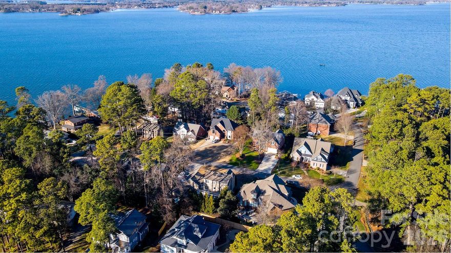 Premier off-water location! Experience the ultimate Lake Norman lifestyle! This home is situated on an elevated lot in the center of the "island" of the Island Forest neighborhood; the aerial pictures say it all! Spacious, open floor plan. Beautiful oak hardwood floors throughout main level. Gorgeous kitchen complete with granite countertops, breakfast bar and awesome backsplash. Expansive breakfast room offers views of the private backyard and custom flagstone patio. Large, open living room features vaulted ceiling, gas fireplace and wonderful natural light. Spacious dining room is perfect for hosting. Large, main level primary bedroom suite complete with huge bath and walk-in closet. The upper level offers 2 large bedrooms, endless space in the expansive bonus room.  Beautifully landscaped yards. Covered back porch leads to custom flagstone patio. Hot tub located directly off the covered back porch offers wonderful opportunities to unwind anytime. Tankless water heater, immaculate crawlspace, spotless 2 car garage, this home has been meticulously maintained. Highly sought after Island Forest neighborhood offers private/gated (residence only) waterfront lot complete with boat ramp and pier! Prime location near parks, restaurants, and boutique shopping. This residence defines the vibrant Lake Norman way of life!