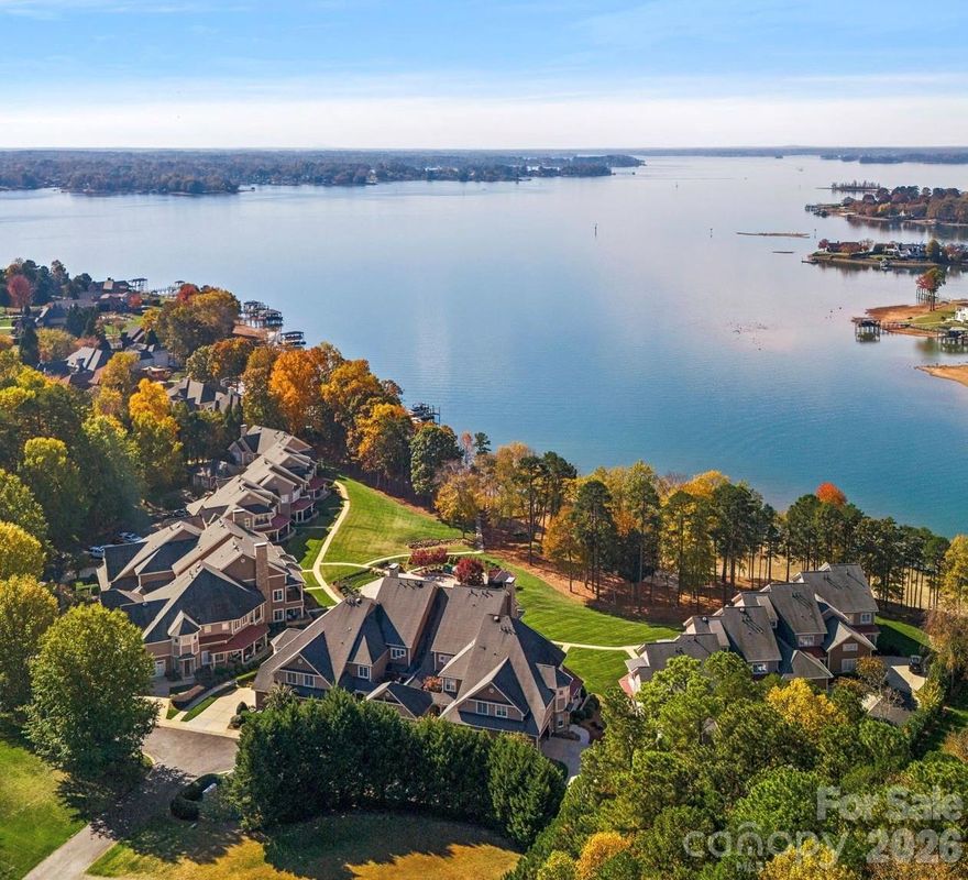 Experience easy luxury living in this renovated waterfront condo at exclusive Cove Key, one of Lake Norman's best-kept secrets.  Spanning over 4,000 square feet, this home delivers breathtaking panoramic views, with spectacular sunsets transforming the night sky from your elevated living areas.  Freshly completed with comprehensive modern updates, it sits poised and ready to welcome its new owners.  A few of many highlights include: soaring ceilings, oversized bedrooms and an incredible and noteworthy amount of storage throughout.  You'll find a dreamy new kitchen with leathered Celestria quartz, new cabinetry, new high end appliances, a butler's pantry with integrated laundry and additional walk-in pantry.  Then there's the magazine worthy bathrooms, Iberian Hazelwood color engineered hardwood, central vacuum, motorized blinds, plus private In-Unit personal ELEVATOR access for seamless convenience between two of the floors.  The flexible floor plan offers 4 bedrooms (or 3 en suite bedrooms with lake views plus a large flex room).  Step out from the primary suite onto direct balcony access for fresh air coffee or evening relaxation; while a second primary bedroom option on the upper level further adds versatility. With just 19 units in exclusive Cove Key, residents can peacefully enjoy a private community pool, spa, beach area and day docks.  This contemporary home fuses classic warm charm with modern luxury in a prime location just off Langtree -- minutes from vibrant shopping, dining, medical facilities and easy i-77 access to Charlotte and beyond.