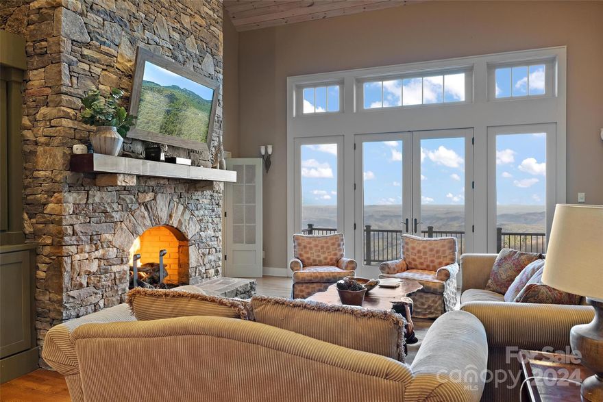 Step into the lap of luxury w/ this custom-built mountain retreat offering breathtaking long-range panoramic views of the gorge. Nearly every room provides front-row seats to stunning sunrises, while the tranquil sounds of a small waterfall, just west of the backyard and visible during the Fall/Winter, create a serene ambiance. Situated on over 1 acre, this home is prime real estate, less than 20 min. from downtown Blowing Rock or Banner Elk, a mere 10 minutes to Grandfather Mountain, & easy access to the scenic Blue Ridge Parkway, restaurants, shopping, hiking, & skiing. This well-maintained & impeccably constructed mountain getaway offers plenty of space. Including 4 bedroom/4 bathroom suites (no closet on main level rm), 5 bathrooms 3 living rms, 3 fireplaces, 2-story composite deck, sealed crawl, & a side patio w/a new hot-tub. So many custom details! Furniture included w/ some exclusions & short-term rentals are permitted, making this property an ideal investment opportunity.