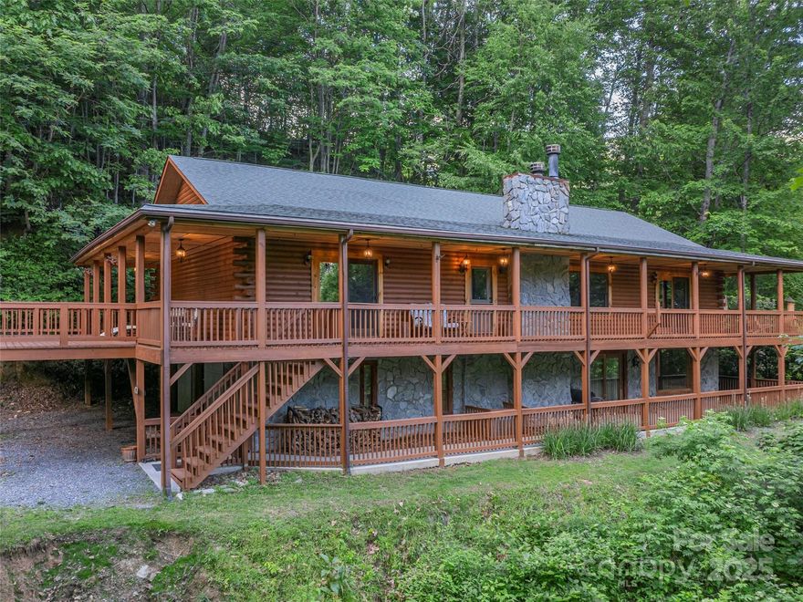 Featuring 3 total bedrooms, 2.5 baths, on a 2-bedroom septic, this home is ideal for full-time living, vacationing, or investment. Tucked away at the end of a quiet cul-de-sac, this stunning 2 story log cabin offers the perfect blend of rustic charm and modern convenience. Step inside to a fully furnished, warm and inviting space with handicap accessibility, a residential elevator, and a whole-house generator for year-round comfort and peace of mind. The main level offers an open living area, spacious kitchen, and primary suite, while the walk-out lower level includes additional living space and access to the 2 car garage. Enjoy the mountain views and serene privacy from the expansive wrap-around porch, perfect for morning coffee or evening relaxation. Situated on a beautifully wooded lot with an additional adjoining lot included, there’s room to expand, garden, or simply enjoy more space and privacy. Smoky Falls POA maintains roads. Rentals allowed.