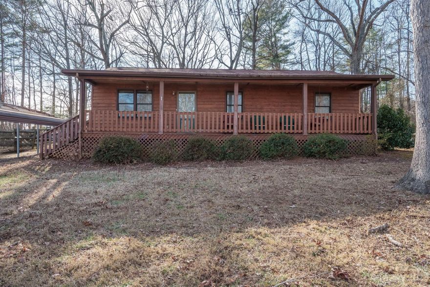 Charming wood and brick cottage in the lovely Green Acres subdivision. This cozy 3 bedroom, 1 bathroom home is nestled on .774 acres, set back from the road, under beautiful mature trees providing ample privacy. Enjoy your morning coffee on the large front porch than spans the entire length of the home. The backyard is fenced in and has a storage shed. There is beautiful LVP flooring throughout most of the home and lovely neutral tile in kitchen. The living room and bedrooms are spacious and the whole house has been very well maintained. This home is a must see!