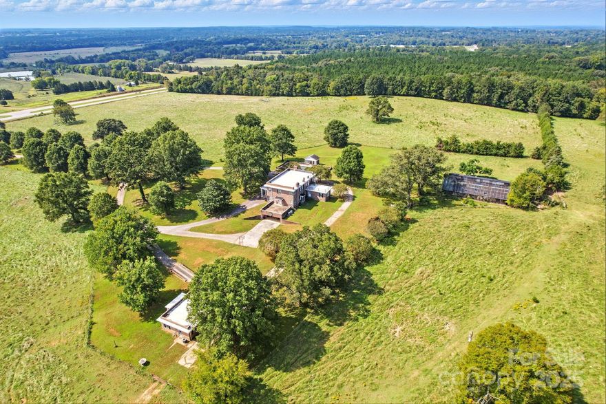 Rare opportunity with 65± acres along one of Chester County’s most traveled corridors. The property features a two-story 5,064± square-foot residence with a partially finished basement showcasing solid construction, as well as a 1,330± square-foot second home currently occupied by a tenant.

Zoned R-2 Rural Two, the property allows for a variety of uses including residential, agricultural, educational, and healthcare facilities — while offering strong potential for commercial or mixed-use development. With 1,500 feet of frontage on Hwy 9/Lancaster Hwy, just 8 miles from I-77, and nearby access to county water and sewer, the site delivers excellent visibility and infrastructure advantages.

Situated near the Gateway planned development area, this property is poised to benefit from Chester County’s ongoing commercial and residential growth. Whether you’re an investor seeking a strong addition to your portfolio or an end user looking for a strategically located site, 1039 Lancaster Hwy delivers exceptional opportunity.