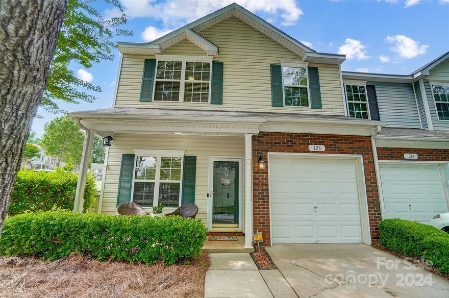 Beautiful end unit with a 1 car garage; across the street from the pool.  Open floor plan on the main level, plenty of kitchen cabinets and counter tops. Refrigerator, dishwasher and range replaced in 2020. Crown molding throughout the downstairs and primary bedroom. Spacious primary bedroom with large walk-in closet and en-suite bathroom.  Upstairs has 2 bedrooms, 2 bathrooms, loft area, and flex room/office. Secondary bathroom upstairs was remodeled in 2022 with beautiful new tile flooring and tile surround. Additional parking space purchased until May 2025. HOA covers water bill, trash pickup, lawn care, exterminating, roof and exterior maintenance. Great location in Fort Mill close to shopping, restaurants and I-77. Move in ready!