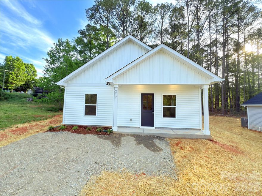 New Construction UNDER $200,000. Discover the quality of a brand-new, site-built home. This single-story residence is designed for low-maintenance living with a durable vinyl exterior and an architectural shingle roof, and  slab foundation. Modern comfort is assured through central heating and cooling, complemented by the reliability of city water and sewer services. One of the greatest advantages of this property is the absence of a homeowner's association, offering you more freedom and flexibility. Nestled in the heart of Norwood, this home places you in a peaceful, small-town atmosphere known as the "Gateway to Lake Tillery". The town offers a vibrant community spirit with easy access to pristine shoreline activities, local boutiques, and the scenic beauty of the surrounding Uwharrie region. This property is an exceptional find for anyone seeking a serene lifestyle paired with modern convenience.