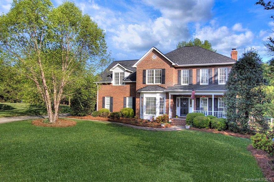 CONTRACT HAS BEEN ACCEPTED BY SELLER - Full brick home on LEVEL, fenced acre lot in desirable Fort Mill school district.  Voluntary HOA! Now that I have your attention..rocking chair front porch invites you into this home that boasts hickory wood floors on first floor (open plan w/ kit open to GR). Sep living/office & formal dining space.  Upstairs has 3 full bedrooms + 4th bedroom/bonus option.  There is an additional room that doesn't have a closet (currently used as a nursery).