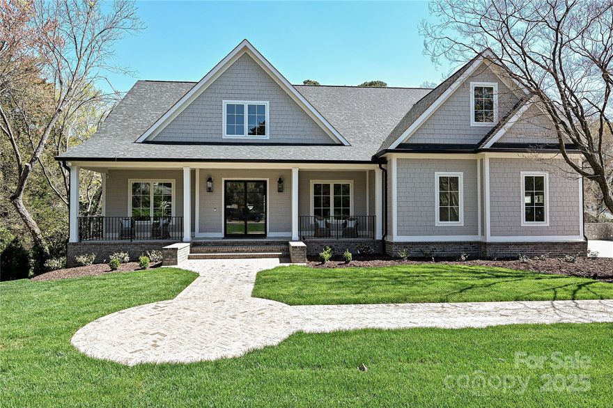 Stunning new construction in Providence Park! This southern cottage style home w/rocking chair front porch, offers 6BR/6BA, 3-car garage on .6 acre lot. A desirable open-concept plan is perfect for modern living. W/natural light throughout, the interior showcases 10’ ceilings on the main & lower levels, 9’ upstairs. A gourmet KT offers SS appls, quartzite countertops, walk-in pantry & large island. Perfect for entertaining, the vaulted great rm flows seamlessly into the dining area, KT & balcony. The main floor primary BA features a serene retreat w/soaking tub, separate shower, dual vanity & walk-in closet. Upstairs are 2 BR/1BA, bonus rm & 2nd laundry. The expansive lower level features a large family rm, cozy FP and dbl French doors opening to large patio. A KT, wine cellar + exercise rm, adjoined by a spacious sauna & large walk-in shower create a spa-like experience. Ample walk-in storage rm. Nicely landscaped, private, fenced backyard w/whole yard irrigation on a quiet street