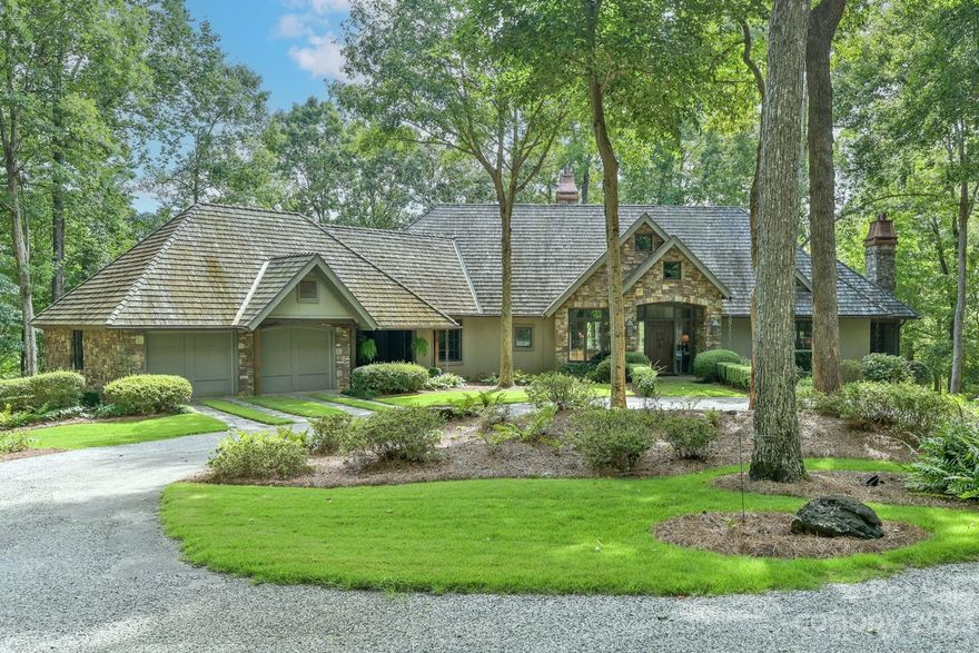 Stunning private estate, on 30 acres, in Caroland Farms. Meticulously laid out landscaping, rolling pastures, and private spring fed lake. Custom copper chimney caps, copper gutters, copper rain chains, and beautiful cedar roof shingles. Open floor plan. Kitchen with stainless Thermador appliances and large center island, cozy sitting area, vaulted ceilings with wood beams.  Custom stone fireplace in living/dining room. Large screened in porch with vaulted ceilings, wood floors and fireplace.  A master suite that offers amazing view of the lake, and a well-appointed sitting room, with wood burning fireplace, his and her bathrooms, with heated floors, rainfall and full body shower. Reclaimed plank flooring throughout the main level. Finished walk out basement living area with coffered ceilings, another fireplace, and wet bar. 2 en-suite bedrooms, one with full spa bath with steam shower. French doors open to waterfall infinity pool, and separate hot tub. The NPA trails.