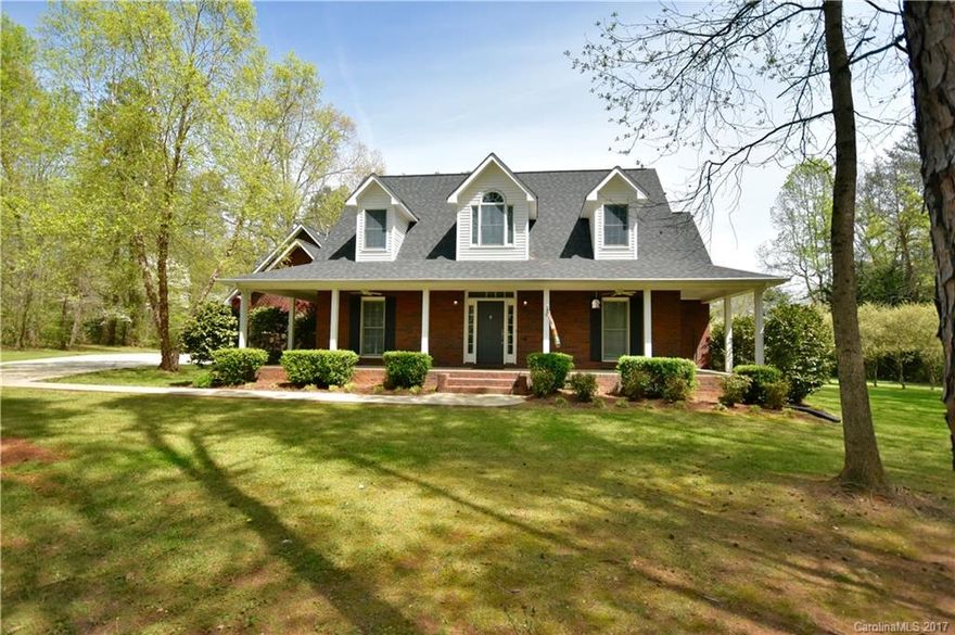 Custom built full brick home on approximately 2 acres in Davidson! Wooded, private deck, wrap around front porch, wood burning fireplace and a 3 car garage. Master suite on main and a private second floor suite. Beautiful, serene and excellent condition! Newly refinished hardwood floors and new interior paint.
