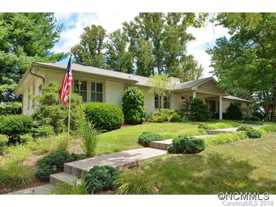Spectacular views of Sunset Mountain and Elk Mountain from one side of the house and views of the French Broad River Valley from the other side.  Come home to North Asheville's convenience and charm in this updated, one level living home on almost an acre.  Large master, covered porch and open kitchen pull it all together.