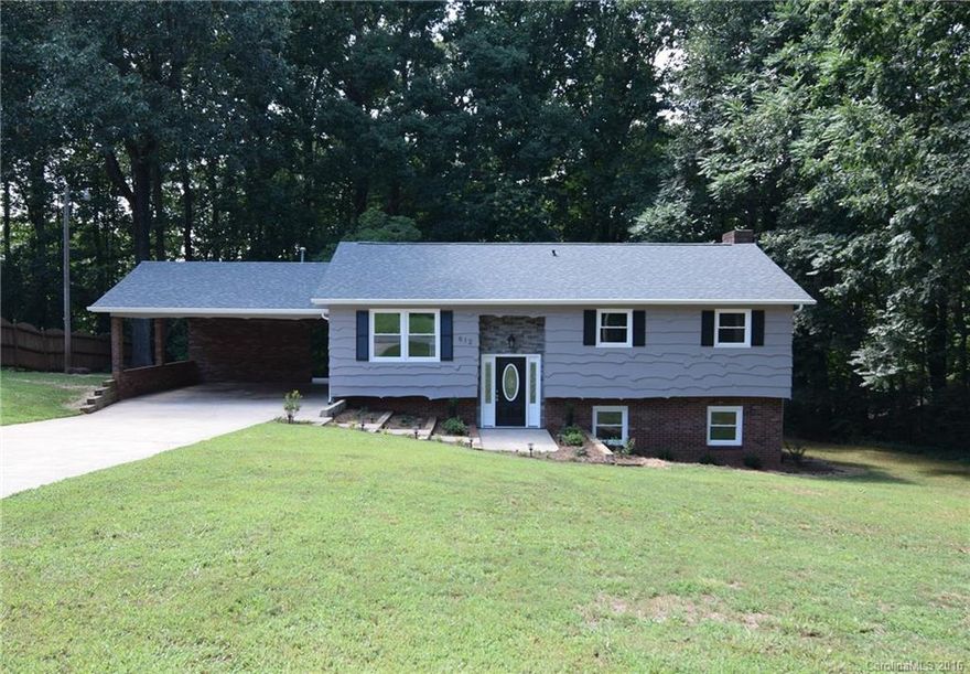 Extensively remodeled, 4 bedroom, 2 bath, split-foyer home with all the upgrades you could want!  Solid, red oak hardwood floors, new kitchen cabinets, granite countertops and stainless appliances.  Both bathrooms have carrera marble vanities and beautiful tiled showers.  Wood burning fireplace in the downstairs, which also has a new HVAC unit.  New 30-year architectural shingled roof!  New deck overlooks a tranquil backyard- perfect for entertaining.  This house is a must see!