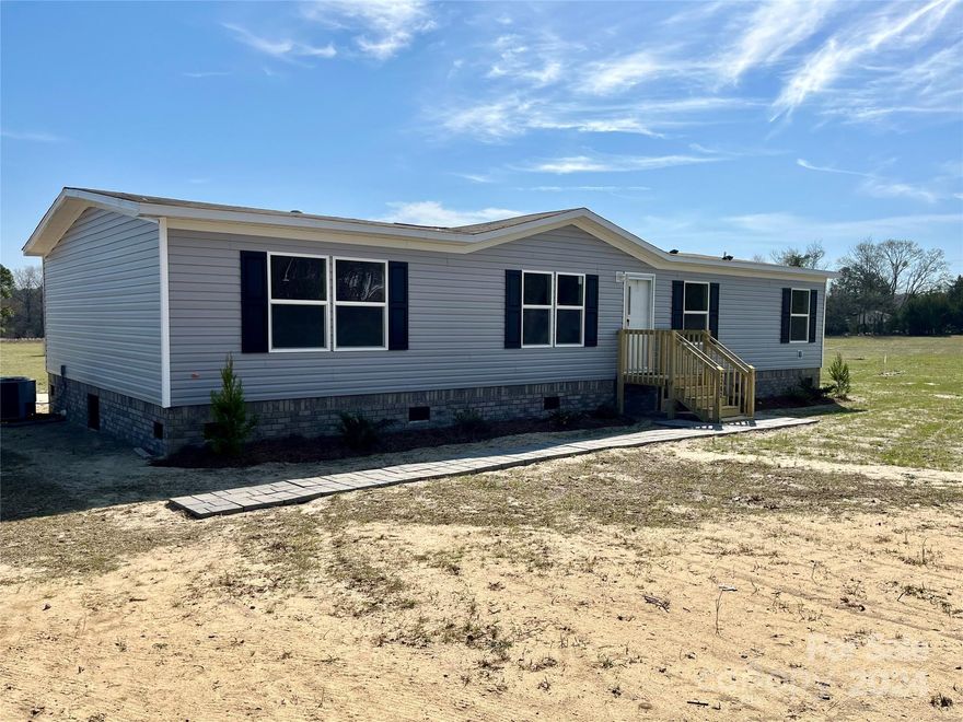 FRESH ON THE MARKET!  Brand new, never lived in, 4 bedroom, 2 bath, cozy manufactured home on 2.5 acres in NORTH CENTRAL SCHOOL AREA.   The property is level, nice Road frontage, approx. 191 ft, as per measure, Kershaw Co. map. Home boast almost 1500 sq ft of floor space.  New stove, refrig. & dish washer already in place.  Grass has been planted on the property and should be coming up soon.   Nice gravel driveway recently installed!  ANOTHER GREAT FEATURE.....  A 1000 gal. septic is on the property for an RV hookup.  This always comes in handy and increases property value.     LOOK OUT FOR THIS ONE!  Should go FAST!  NORTH CENTRAL SCHOOL DISTRICT! GO KNIGHTS!