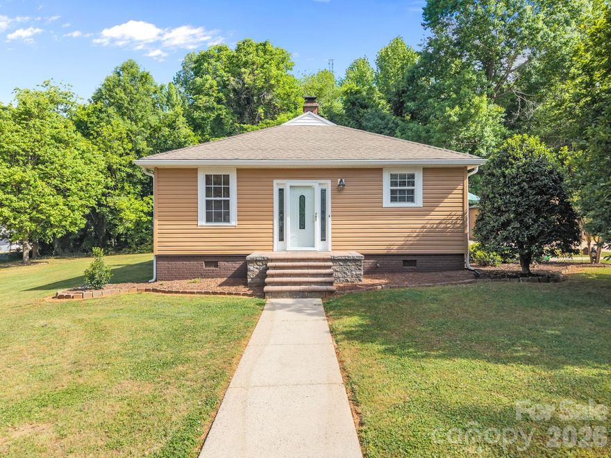 Set on nearly three-quarters of an acre in Salisbury, this updated 3-bedroom, 2-bath home offers over 2,000 square feet of well-designed single-level living. Skylights and insulated windows bring in consistent natural light, highlighting the hardwood floors and built-in details throughout the main living areas. The living room centers around a fireplace and flows easily into the rest of the home. The kitchen is equipped with an electric range, dishwasher, microwave, water softener system, and ample cabinetry, along with a pantry and a layout that supports both everyday use and entertaining. The primary suite is privately positioned with a walk-in closet and an ensuite bath that includes a soaking tub, separate shower, and dual vanities. Two additional bedrooms and a dedicated office provide flexible space for guests, work, or hobbies. A sunroom lined with windows overlooks the backyard and offers a comfortable year-round retreat. The unfinished basement—approximately 607 square feet—adds significant storage, workspace, or future expansion potential. Outdoor spaces are thoughtfully arranged, with a patio leading to an in-ground pool, firepit area, and gazebo. The fenced backyard includes fruit trees and provides both privacy and usable green space. The property is serviced by both county water and a private well, each connected to a Puronics filtration system (a $7,000 value). The current setup uses county water for household needs, while the well supports outdoor use such as pool refilling, car washing, and irrigation. A detached two-car garage and additional storage shed complete the property. There is a Duke energy easement along the driveway of this property.