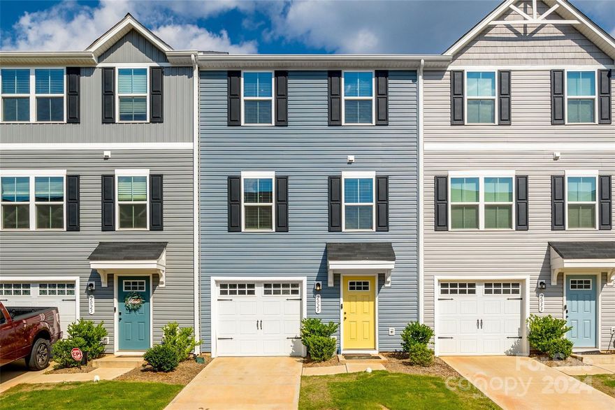 Beautifully finished and sleek, 3-story townhome minutes from uptown Charlotte. The main living area boasts an open concept layout with LVP flooring, seamlessly flowing to the kitchen with ss appliances and quartz countertops, breakfast area, and great room, creating an ideal space for entertaining and personal enjoyment. Upstairs, you'll find 3 bedrooms with finished, walk-in closets and 2 full baths. The lower level features a painted 1-car front garage with a custom-installed, hardwired EV charger. The home features fresh paint and professionally cleaned carpets, showcasing beautiful finishes throughout. MyQ Smart Garage and all appliances, including the washer & dryer, will be included with the home. Call today to schedule your private tour!