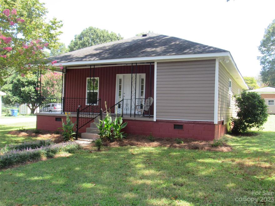 Move in ready. Short drive to CLT airport and Whitewater Center. I-85 and Downtown Mt. Holly close by. Large rooms throughout the home. New sheetrock. Fresh paint. New countertops and cabinets in the kitchen. Double vanity in the bathroom. New interior lighting. Updated electrical. New windows and interior doors. New Heat pump installed 2023. Nice eat in Kitchen with good cabinet and counter space plus 2 large pantries for additional storage. This home has a very good floor plan with lots of closet space. Front bedroom has a large walk in closet in addition to the standard bedroom closet.  Seller will consider adding a gravel driveway for off street parking on the back left side with an acceptable offer. The front of home has a large covered porch and the back has a large deck. This is a must see.