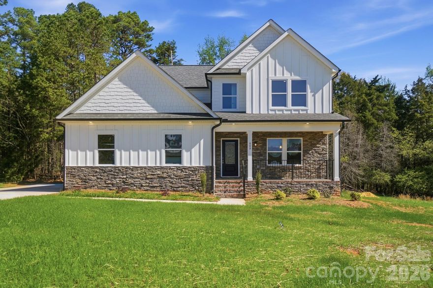 Beautiful new construction home in the Muirfield community offering the perfect blend of space, style, and functionality. This thoughtfully designed 2-story home features 4 bedrooms, 3.5 bathrooms, and over 3,300 square feet of living space. The open-concept main level is filled with natural light and showcases a spacious kitchen with a large island, modern finishes, and a walk-in pantry, all flowing seamlessly into the living and dining areas.

The primary suite is conveniently located on the main level, with additional bedrooms and a versatile bonus room upstairs. Enjoy outdoor living on the covered back porch overlooking a peaceful, tree-lined setting. A 2-car garage provides ample storage and convenience.

Don’t miss this opportunity to own a brand-new home in Albemarle!