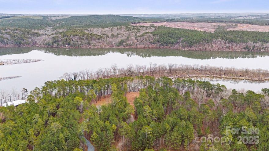 This gorgeous lot is cleared and ready for your dream home! With breathtaking views of the sunrise over the Pee Dee River, this 1.4-acre property offers the ideal blank canvas for your vision. The lot has a roughed in driveway and an installed culvert pipe, making it easy to start your building project. Located in a secure, private gated community, you'll have convenient access to the lake for various recreational activities. The lakeside pavilion provides plenty of space for relaxation and outdoor gatherings. Property owners enjoy the use of a bathhouse equipped with a restroom, shower, and laundry facilities. With hundreds of acres available for horseback riding, hiking, and hunting in the nearby wildlife preserve, the possibilities for adventure are endless. Now is the perfect time to create your ultimate retreat or weekend getaway, the possibilities are endless.