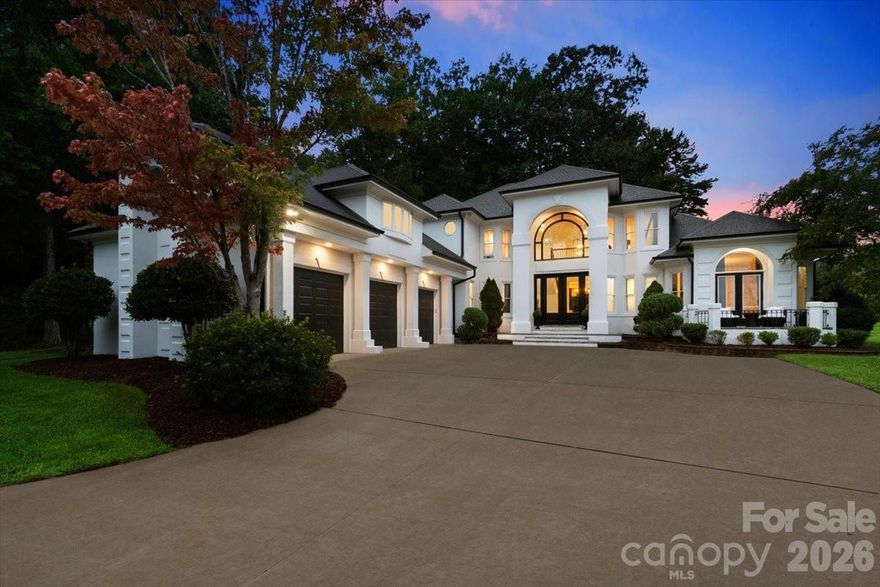 A rare gated lakefront retreat in South Charlotte, this fully remodeled 4-bedroom, 4.5-bath estate is set on 3 private acres at the end of a quiet Lake Providence cul-de-sac. Offering a unique blend of privacy and convenience, the home is just minutes from Waverly, Blakeney, Rea Farms, and top-rated Weddington schools.

Inside, the home has been thoughtfully updated with high-end finishes throughout. The chef’s kitchen features quartz countertops, an oversized island, farmhouse sink, and premium KitchenAid appliances, including a 48” refrigerator, double oven, cooktop, and vented hood. Open living spaces are enhanced by vaulted and coffered ceilings, along with updated flooring, trim, lighting, and custom handrails.

The main-level primary suite offers a true retreat with serene lake views, a private stone patio, dual walk-in closets, and a spa-inspired bath complete with soaking tub, dual vanities, and a rain shower. Additional bedrooms, a spacious bonus room, and a flexible office or studio provide room to live, work, and entertain.

Outdoors, multiple patios overlook the water, creating the perfect setting for gatherings or quiet relaxation. A gated entrance, and a three-car garage provide both security and functionality, while an updated laundry room with sink and drop zone adds everyday convenience.

This is a rare opportunity to own a private lakefront property with modern updates in one of South Charlotte’s most desirable areas. Schedule your private showing today!