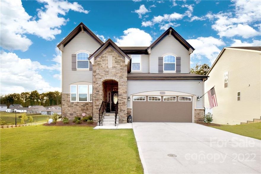 This beautiful basement home in Concord is stunning! The owners have upgraded the lighting and added custom touches like barn doors, USB ports in the outlets, and brand new custom shades. The large level driveway leads to a gorgeous stone-flanked entry and then to an ample home with plenty of living space for everyone. There is a private study, a huge living and dining area and a gorgeous island with tons of open seating on the main floor. In addition to a private half bath, there is also an en suite full guest suite. Outside is a deck for entertaining as well as a terrace below and this lot boasts some amazing sunset views behind the tall trees. Upstairs there is a huge master bedroom suite and three large bedrooms/bath and a loft. The full finished basement offers multi-functional space galore with a bedroom suite, media, great room and play room space. All of this and low Cabarrus Co taxes and great schools ( close to Concord/ Charlotte/ Lake Norman)make this home a must-see!