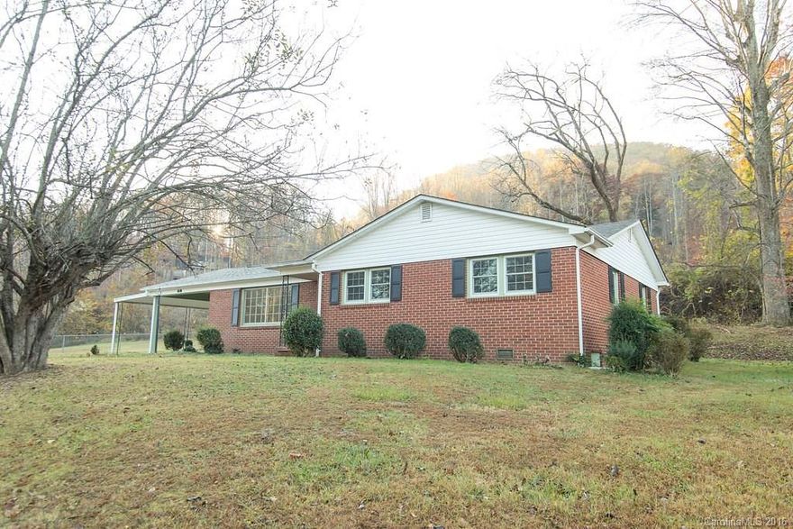 This brick 3 bedroom/2 Bath home offers +/- 1600 heated square feet +/- on a excellent and highly desirable Marion street. The interior gives a formal living room, large den with wood stove fireplace, kitchen plus separate dining room, hardwood flooring under the existing carpet (per property owner), plus a laundry room off the den. The home has central heat/air, replacement windows,  and a 2014 roof. The exterior gives a concrete rear yard patio, front porch, and included storage building.