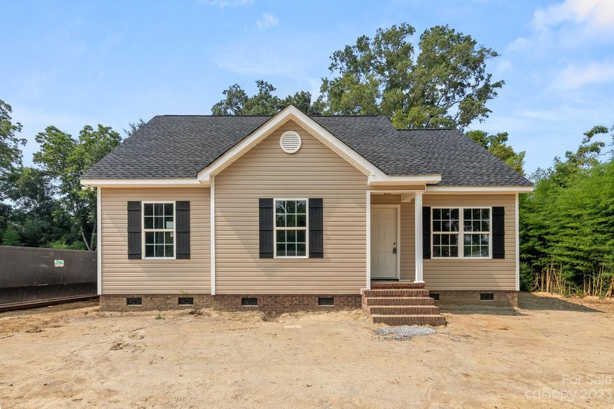 ALMOST 100%, Come See this Beautiful NEW Construction Home on almost .25 Acre lot!  WOW, Vaulted Ceilings as you enter The Palmetto Plan built by Saranac Management Group.  Designer Barnwood LVP Flooring throughout this entire home. Great Room is a nice size & features a Ceiling Fan. OPEN Floor-plan! Dining Area opens-up to the AWESOME Kitchen.  Kitchen feature White Shaker Cabinets, Dallas White Granite and Full Stainless Steel appliance package! Off of the Kitchen is the Utility/ Laundry Room. This space is big enough to add more shelving for additional Pantry Storage. Down the hallway are 2 Guest Suites and are a good size. Guest Bath features a white Granite Vanity w/ Tub-shower Combo. Primary Suite is HUGE with Ceiling Fan and walk-in Closet.  Primary Bath also has Granite Vanity with Tub-shower combo. Enjoy the outdoors on your NEW Deck!  Yard is level and full of Mature trees in the Back of the lot.  Come see this one, this just might be home for you!!