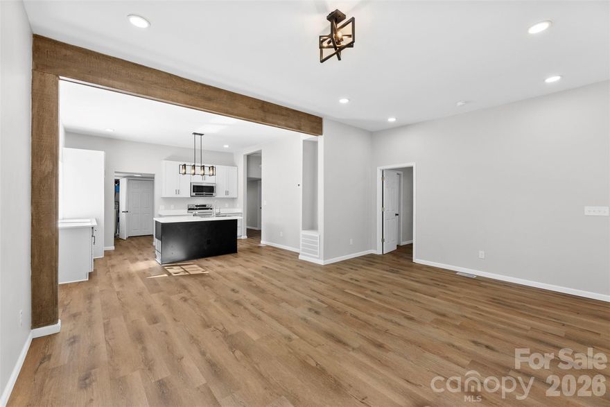 Fully renovated 3BR/2BA home offering an open layout and modern finishes throughout. Renovations include new HVAC, electrical, and plumbing, providing move-in-ready condition. Interior features 10-foot ceilings, new flooring, and an exposed wood beam that adds character to the main living area. The kitchen is equipped with quartz countertops, stainless steel appliances, soft-close cabinetry, and ample storage. The primary bedroom includes an ensuite bath. A side entrance opens to a functional mudroom with laundry and additional storage. Bonus flex space offers versatility. Extended front porch and fenced side yard enhance outdoor living. 100% financing options may be available for qualified buyers. Program eligibility, terms, and conditions apply.