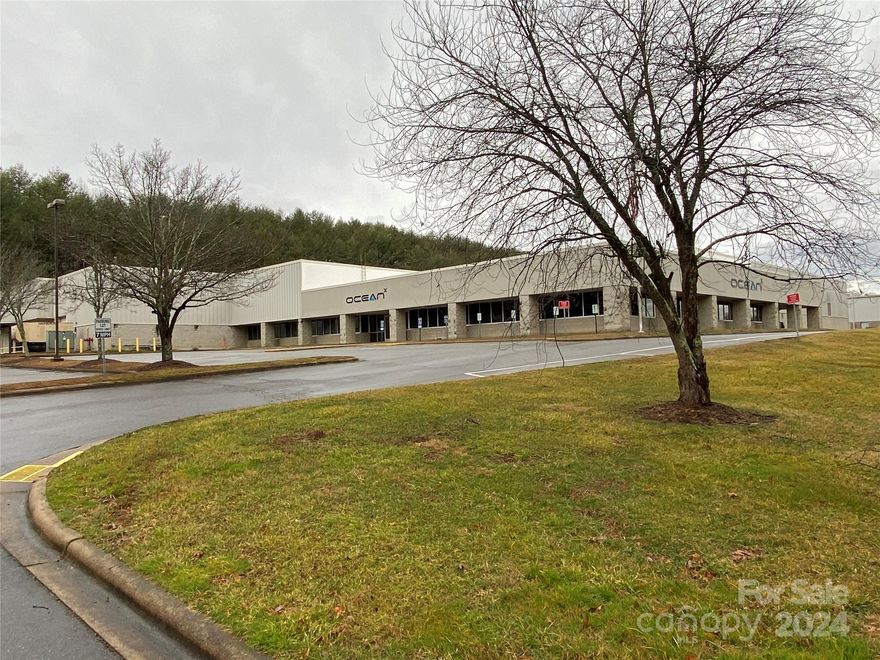 Immaculately maintained 65,217 SF warehouse on approx. 4.3 acres in prime location.  Formerly occupied by Ocean-X.  15,000 SF of building is office/call center space; 110 parking spaces/ new 20 year roof; 7 dock doors.  Parking and drives to be re-paved.  

Prominent, readily accessible location fronting Brevard Rd/ near Long Shoals intersection/ at the entrance to The Cliffs; opposite the Borg Warner corporate campus.  

Exceptional value for a turnkey Class A facility in this location (priced well below replacement cost).