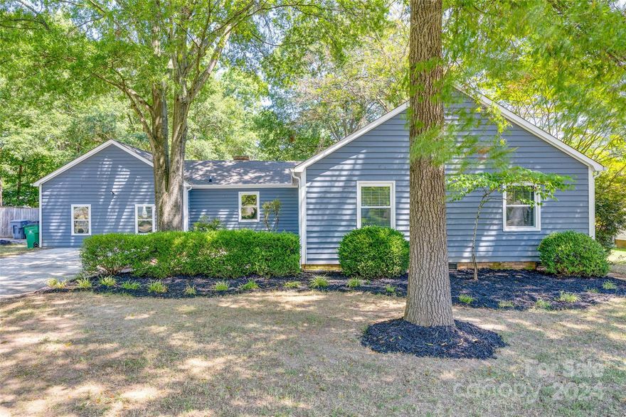 Experience the timeless charm of a remodeled 1970s home. Enjoy cozy evenings by the wood-burning fireplace or entertain effortlessly in the spacious bonus room. The kitchen and bathrooms have been thoughtfully modernized, offering contemporary style and convenience with custom tile work and marble floors. The beautifully landscaped grounds enhance your outdoor enjoyment with ample space for entertaining including a rose garden, deck, playset area, green space, established trees, and storage shed. Enjoy the benefits of having no HOA, thoughtfully located near the Atrium Health Pineville hospital, shopping, dining, and major highways, this home combines classic appeal with modern comfort and accessibility. A true gem in a prime location!